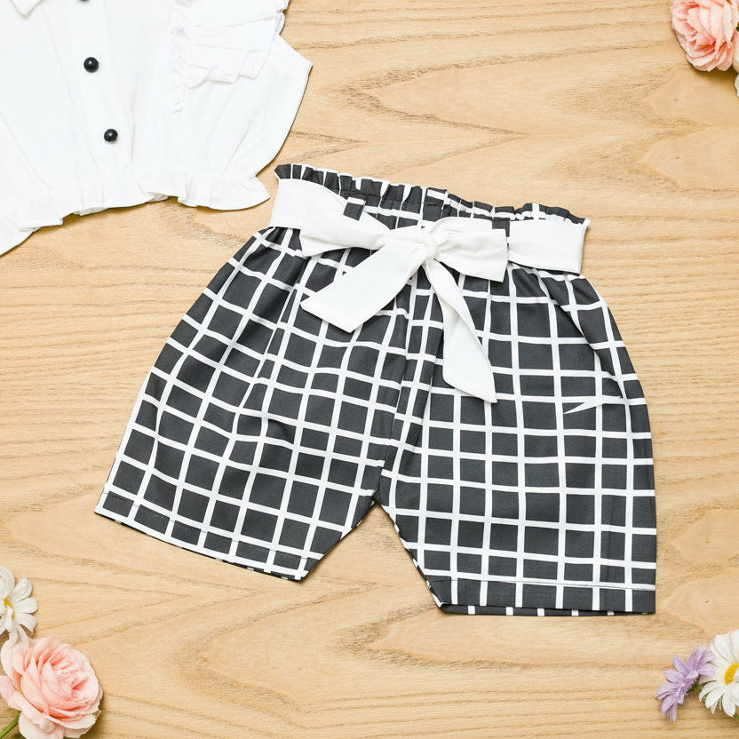 Black and white checkered shorts with a white bow