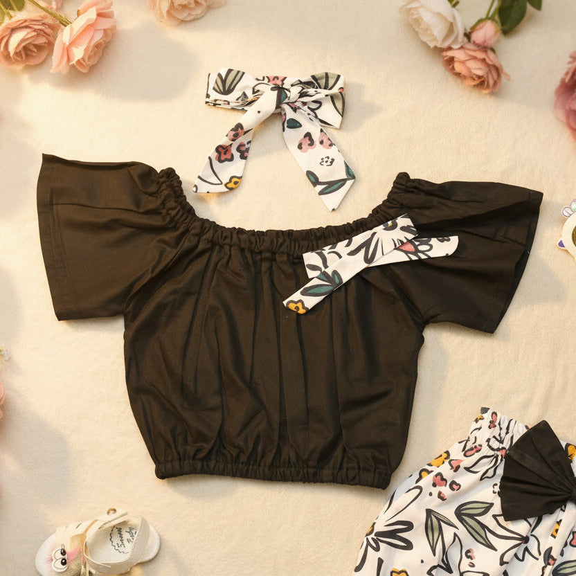 Black off-shoulder top with floral headband