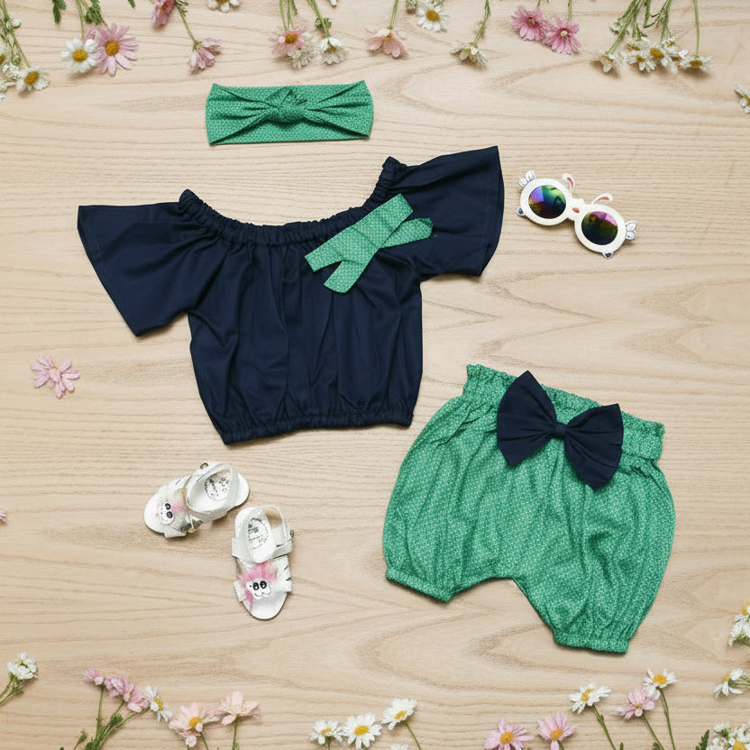 Children's navy top and green shorts set with accessories