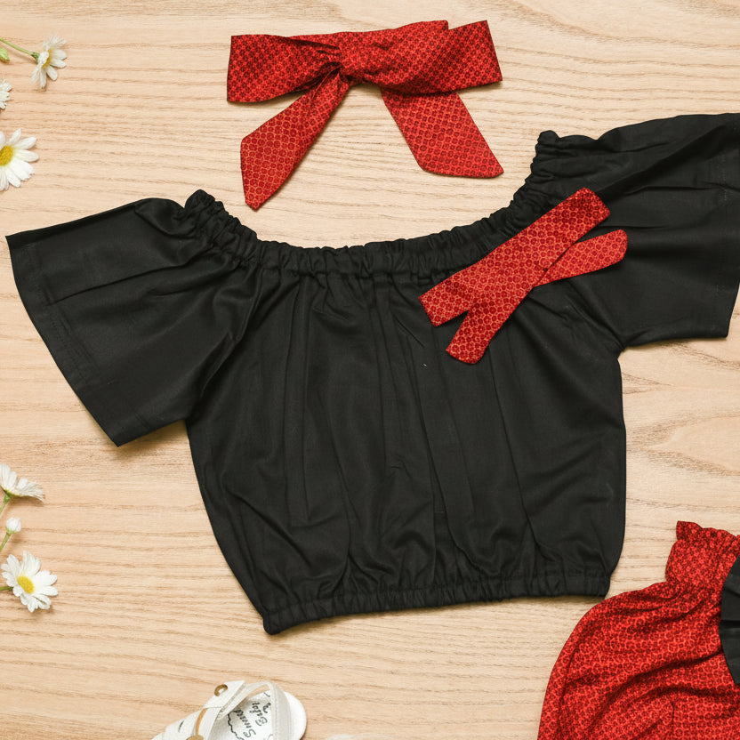 Black top with red bow accents