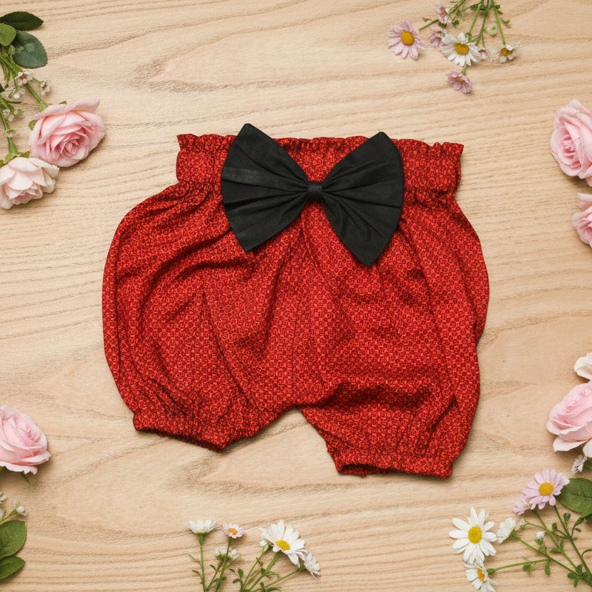 Red baby bloomers with a black bow
