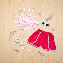 Children's pink floral top and red shorts 