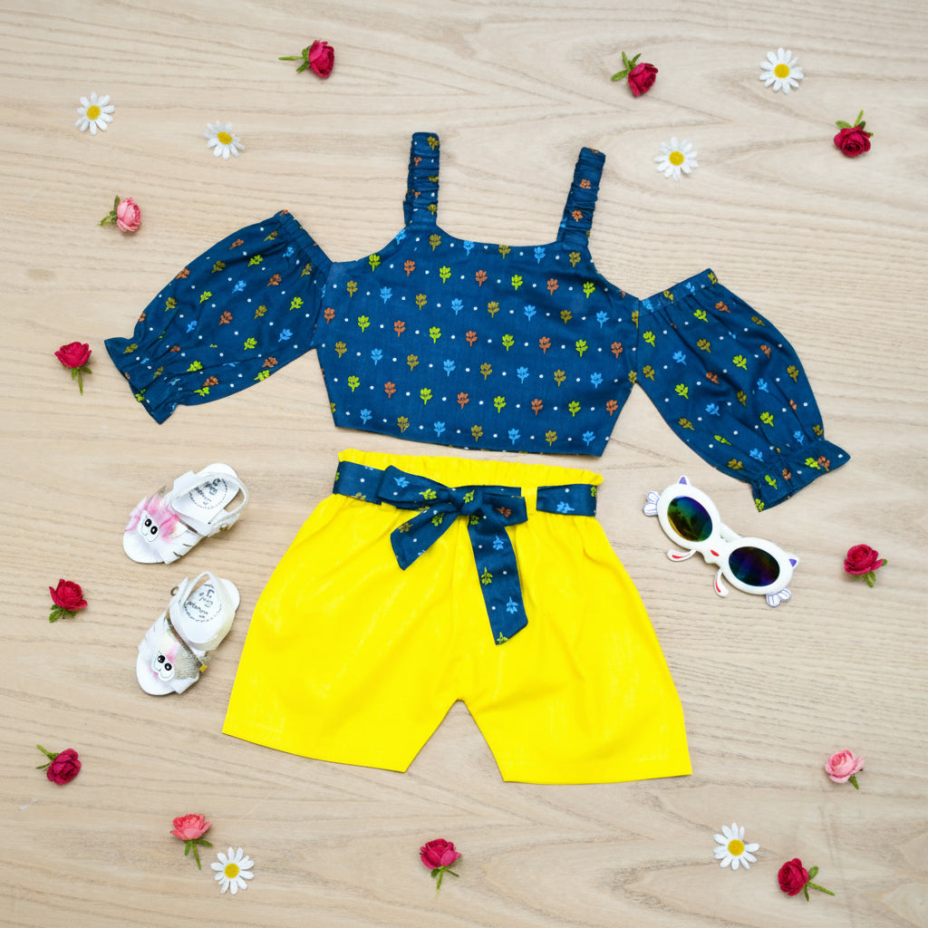 Children's outfit with blue top and yellow shorts