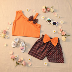 Children's outfit with orange top and shorts