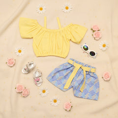 Yellow crop top, blue patterned shorts